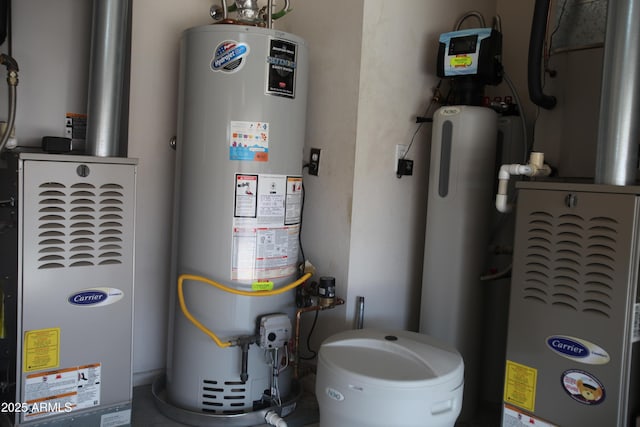 utility room featuring water heater