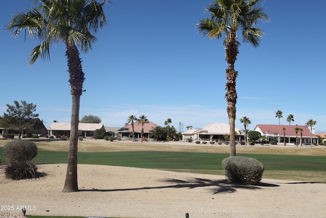 view of property's community featuring a lawn