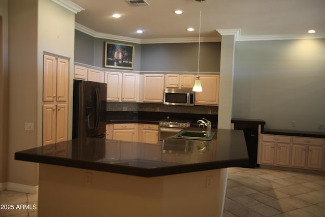 kitchen with stainless steel appliances, dark countertops, a sink, and light tile patterned flooring