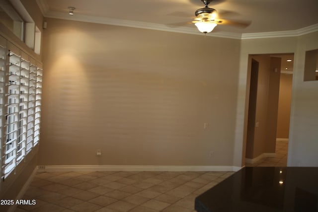 unfurnished room with a ceiling fan, crown molding, baseboards, and light tile patterned floors