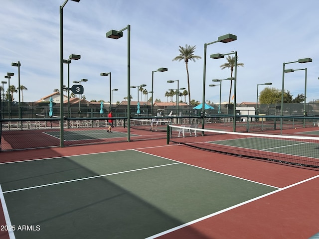 view of sport court featuring community basketball court and fence