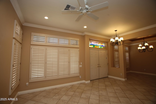 tiled entryway with baseboards and ornamental molding