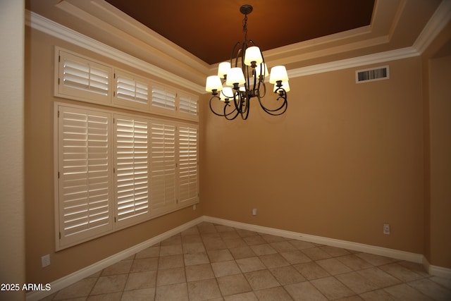 empty room with a notable chandelier, visible vents, baseboards, a raised ceiling, and crown molding