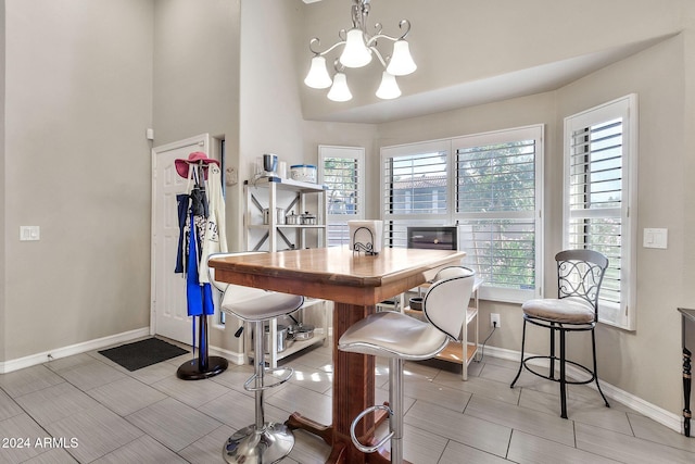 dining area with an inviting chandelier