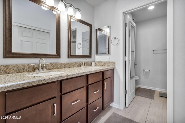 bathroom with vanity and tile patterned floors