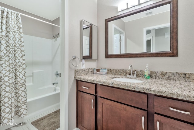 bathroom with vanity and shower / bath combo with shower curtain