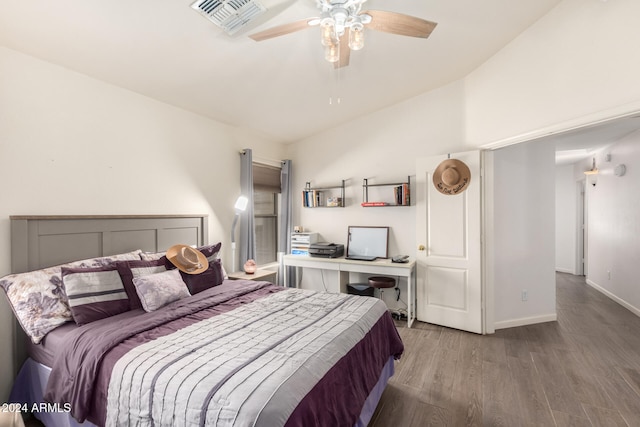 bedroom with light hardwood / wood-style floors, vaulted ceiling, and ceiling fan