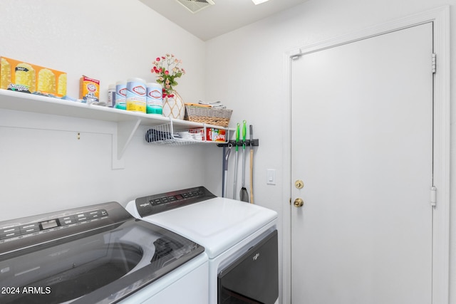 clothes washing area featuring washing machine and dryer