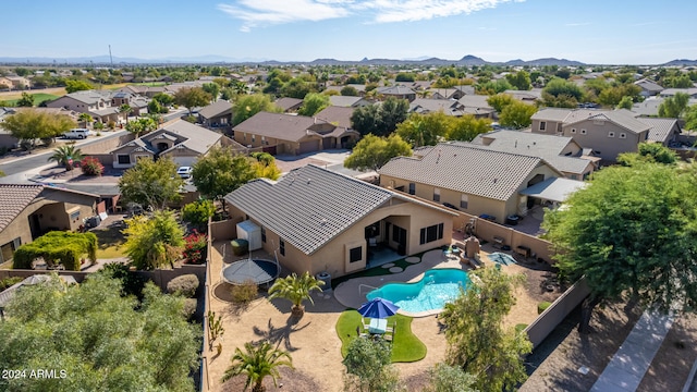 birds eye view of property featuring a mountain view