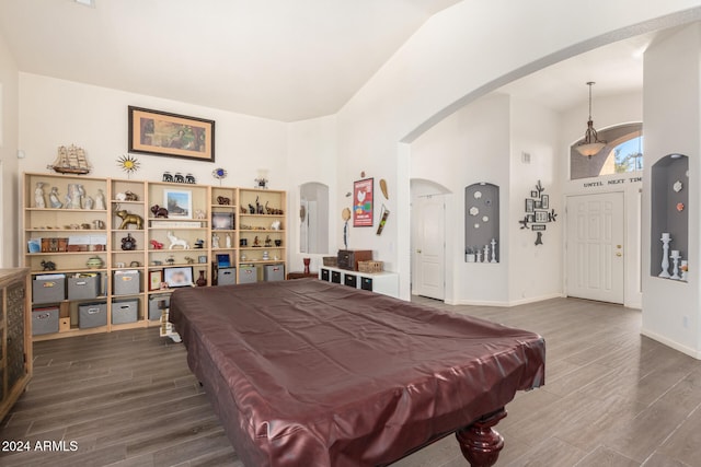 playroom featuring hardwood / wood-style floors, high vaulted ceiling, and pool table