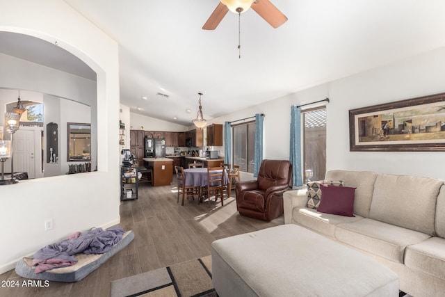 living room featuring ceiling fan, dark hardwood / wood-style flooring, and lofted ceiling