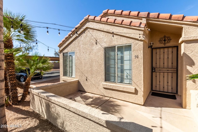 view of side of home featuring a patio