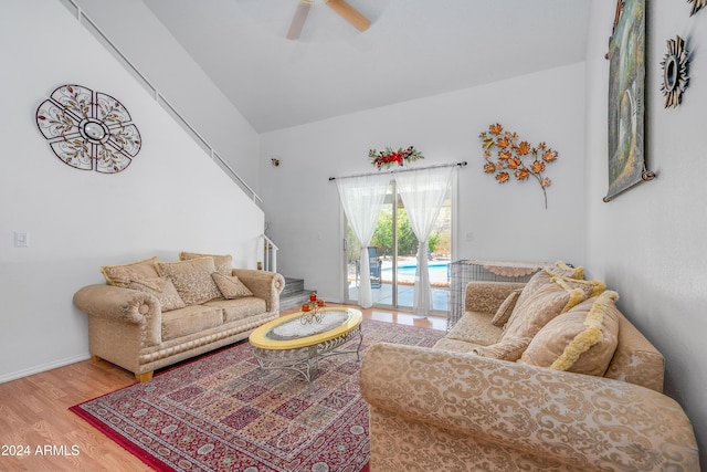 living room featuring ceiling fan and hardwood / wood-style flooring