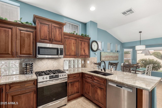 kitchen featuring decorative backsplash, sink, kitchen peninsula, stainless steel appliances, and lofted ceiling