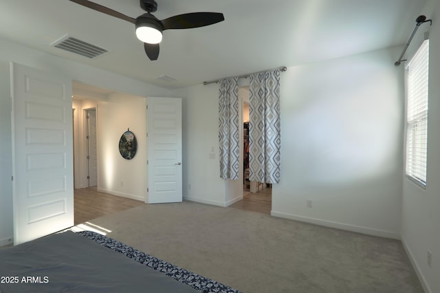 4149 E Appaloosa Rd, Gilbert, AZ 85296 - unfurnished bedroom with multiple windows, visible vents, baseboards, and carpet flooring