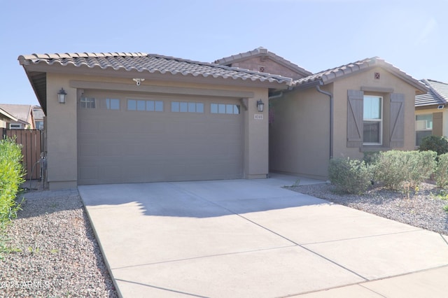 4149 E Appaloosa Rd, Gilbert, AZ 85296 - view of front of home with a tile roof, stucco siding, an attached garage, and concrete driveway