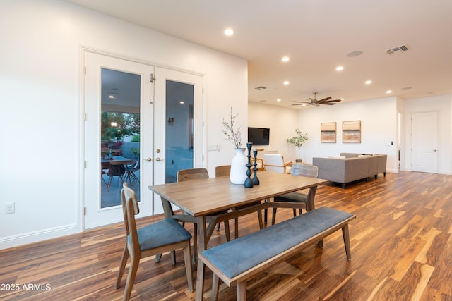 dining space with french doors, recessed lighting, visible vents, dark wood-type flooring, and baseboards