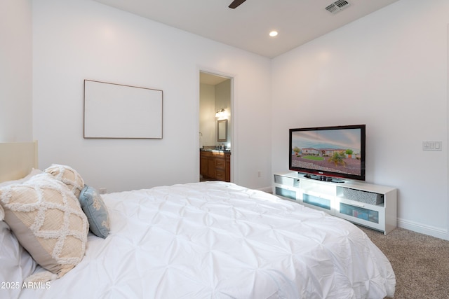 bedroom featuring carpet floors, recessed lighting, visible vents, ensuite bath, and baseboards