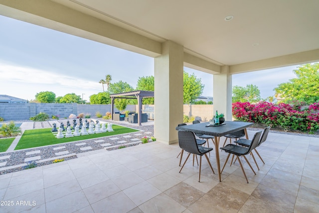 view of patio with a fenced backyard, outdoor dining area, and an outdoor living space