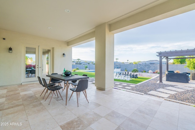 view of patio with a fenced backyard, a pergola, and outdoor dining space