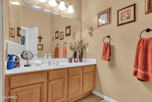 bathroom featuring tile patterned flooring and vanity