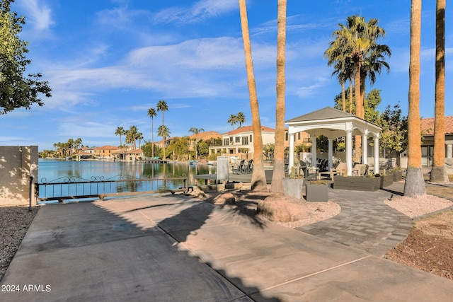 exterior space featuring a water view and a gazebo