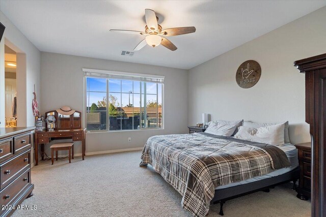 carpeted bedroom featuring ceiling fan