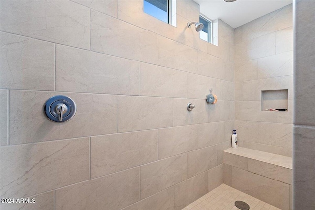 bathroom featuring a tile shower