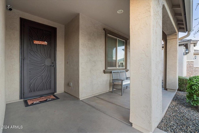 property entrance featuring covered porch