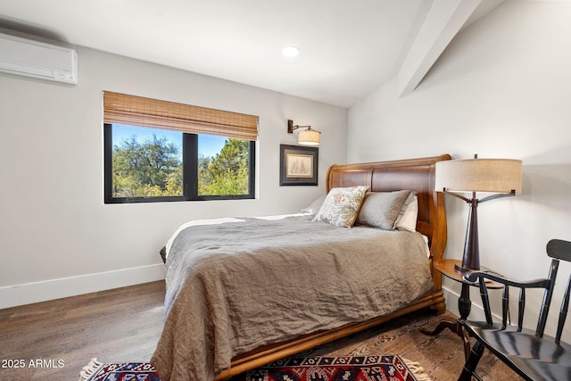 bedroom featuring a wall mounted AC, vaulted ceiling, recessed lighting, baseboards, and wood finished floors