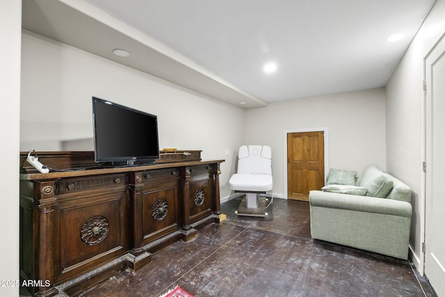 living area with baseboards and recessed lighting
