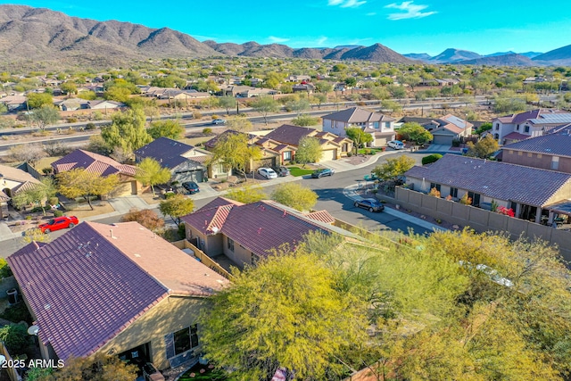 birds eye view of property with a mountain view