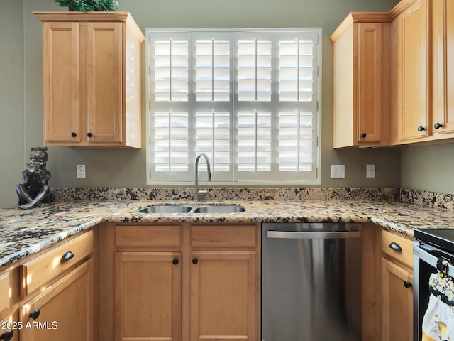 kitchen with sink, plenty of natural light, light brown cabinetry, and stainless steel appliances