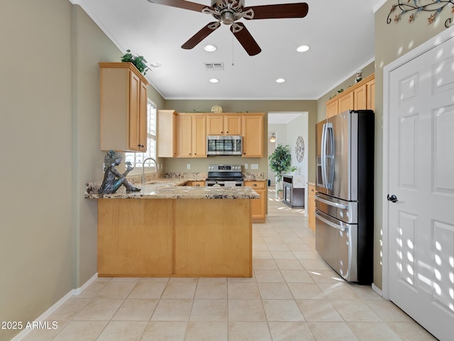 kitchen with light brown cabinetry, kitchen peninsula, light tile patterned floors, and stainless steel appliances