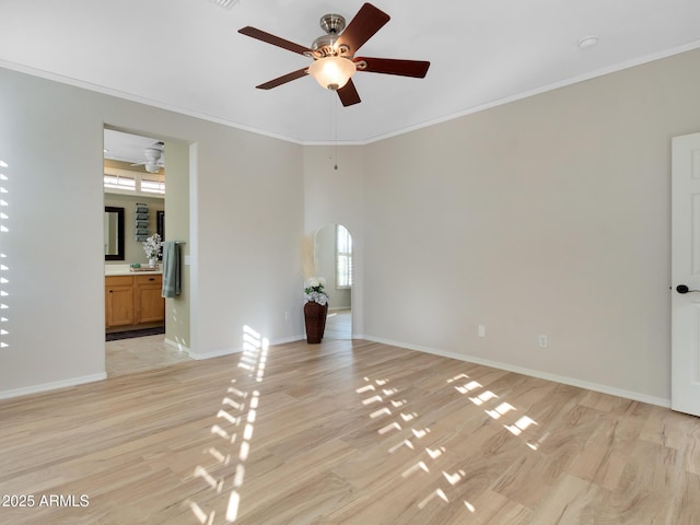 unfurnished room featuring ceiling fan, light hardwood / wood-style flooring, and crown molding