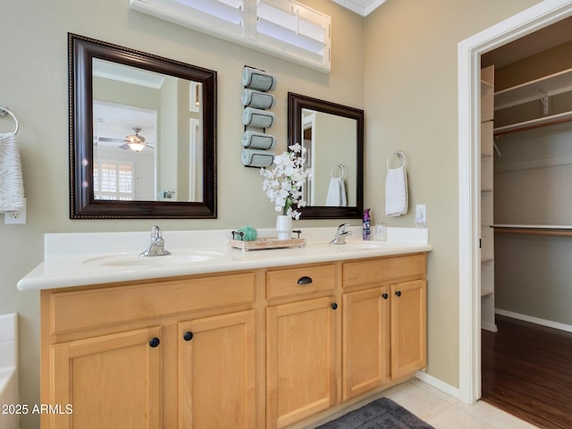 bathroom with ceiling fan, vanity, and tile patterned flooring