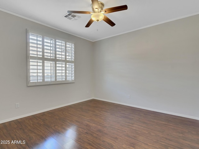 spare room with ceiling fan, ornamental molding, and dark hardwood / wood-style flooring