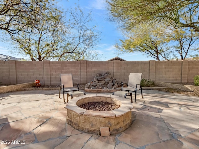 view of patio featuring an outdoor fire pit