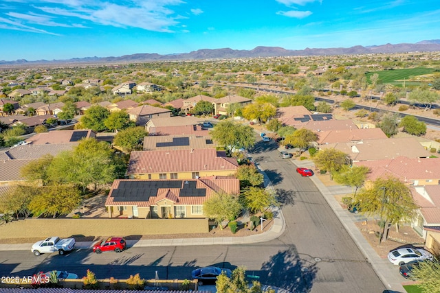 birds eye view of property with a mountain view