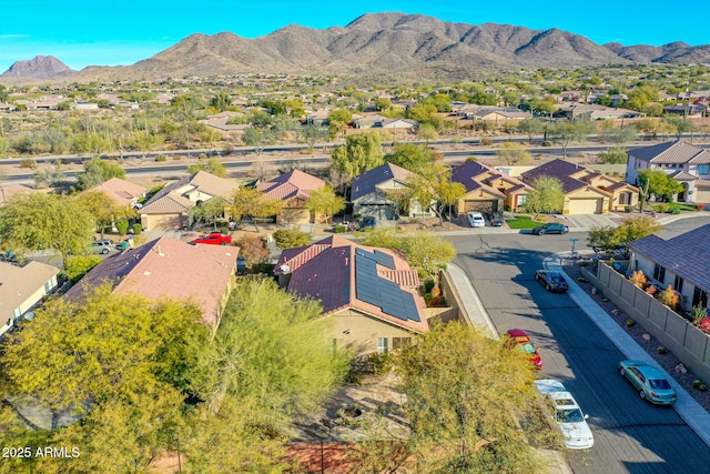 birds eye view of property featuring a mountain view