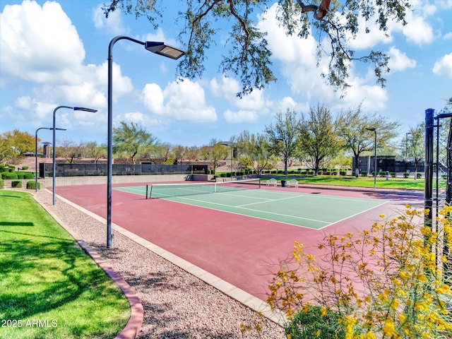 view of tennis court featuring basketball hoop