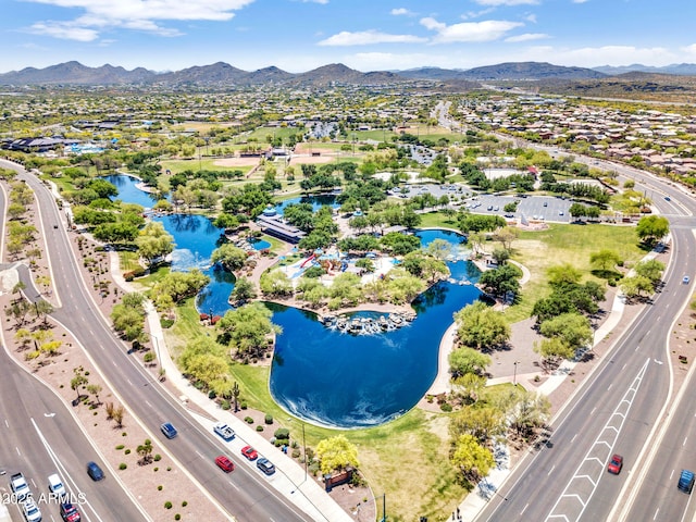 aerial view featuring a water and mountain view