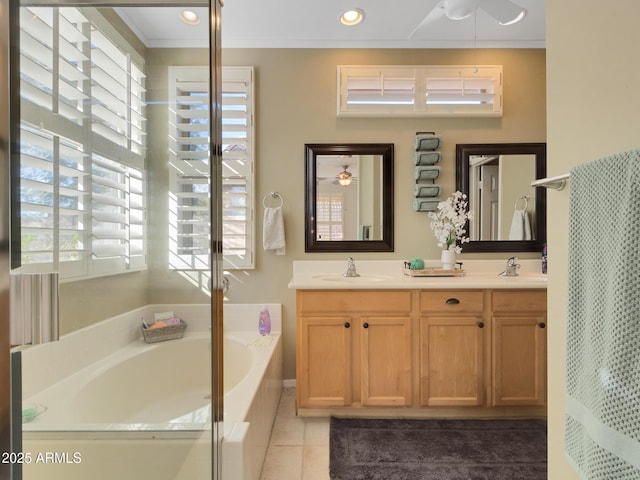 bathroom featuring a bath, tile patterned floors, ceiling fan, and vanity