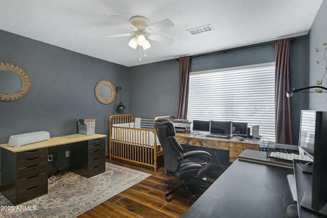 office with dark hardwood / wood-style floors and ceiling fan