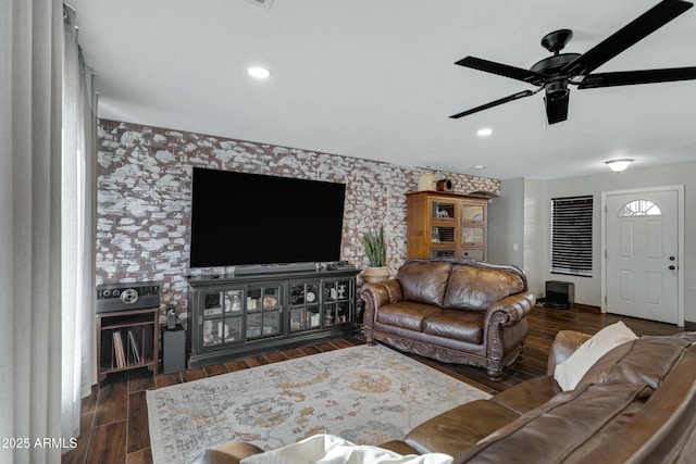 living room featuring dark hardwood / wood-style floors and ceiling fan