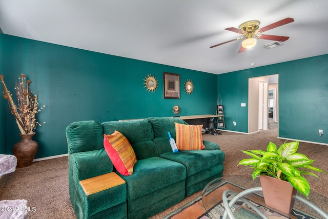 carpeted living room with ceiling fan