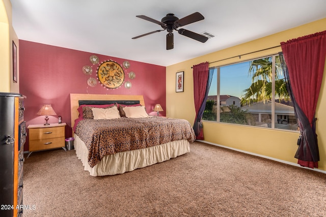 carpeted bedroom featuring ceiling fan