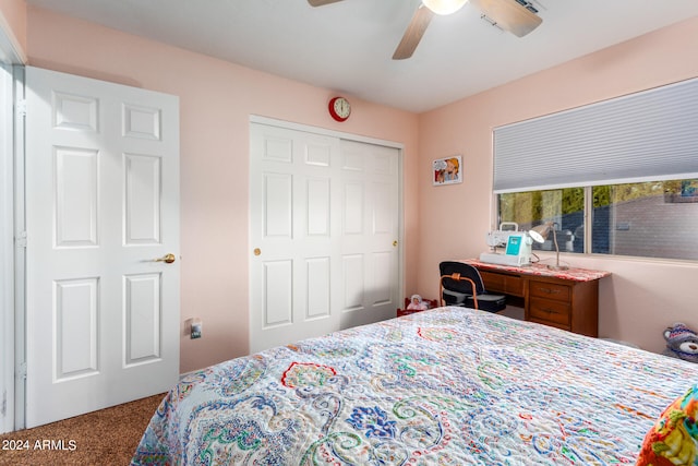 bedroom featuring ceiling fan, a closet, and carpet flooring