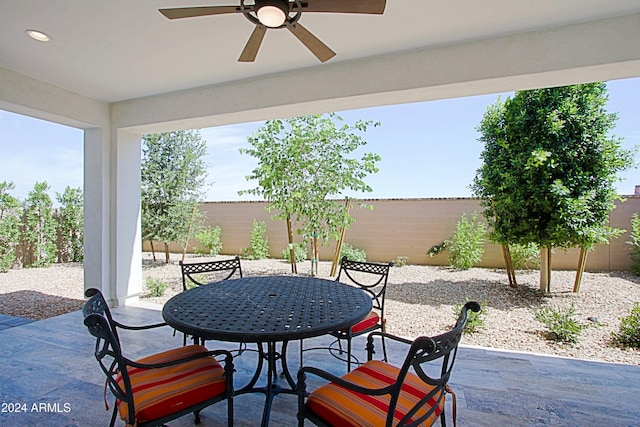 view of patio featuring ceiling fan