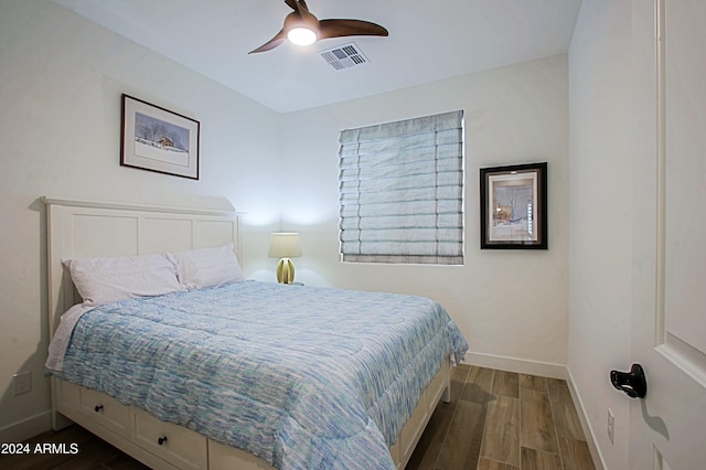 bedroom featuring dark hardwood / wood-style flooring and ceiling fan